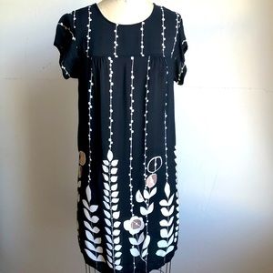 Semi sheer mini sheets dress with floral motif in a light-weight crepe fabric